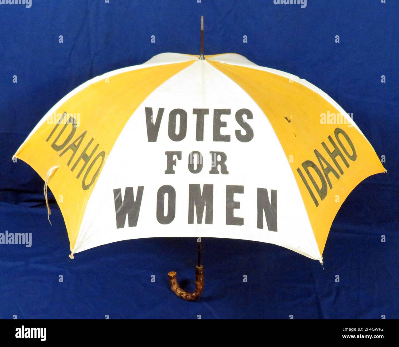 Women's suffrage umbrella with text reading Votes for Women and Idaho, in white and yellow color, 1910. Photography by Emilia van Beugen. () Stock Photo