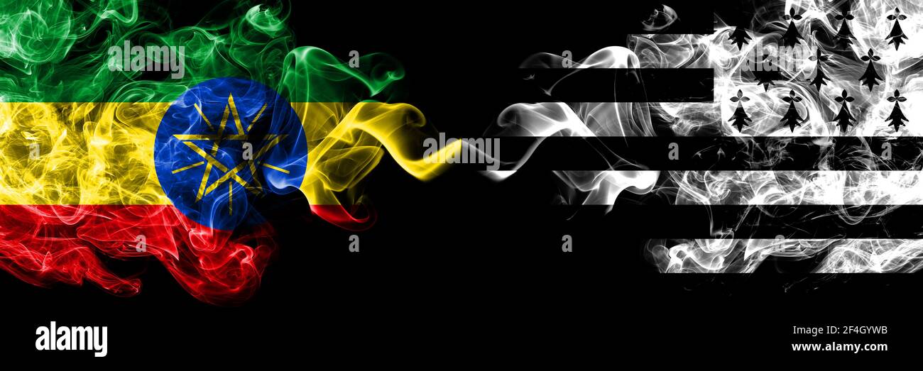 Ethiopia, Ethiopian vs Brittany, Bretagne, Bretons smoky mystic flags placed side by side. Thick colored silky abstract smoke flags. Stock Photo