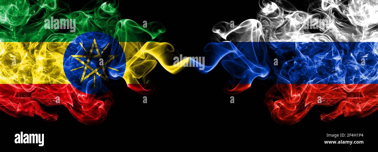 Ethiopia, Ethiopian vs Russia, Russian smoky mystic flags placed side by side. Thick colored silky abstract smoke flags. Stock Photo