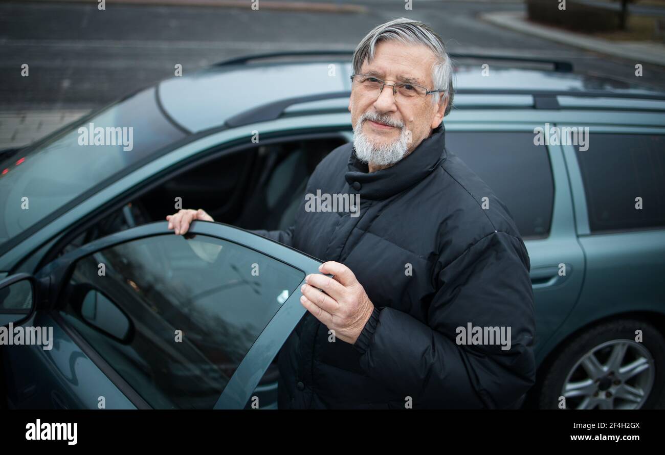 Senior man driving waving hi-res stock photography and images - Alamy