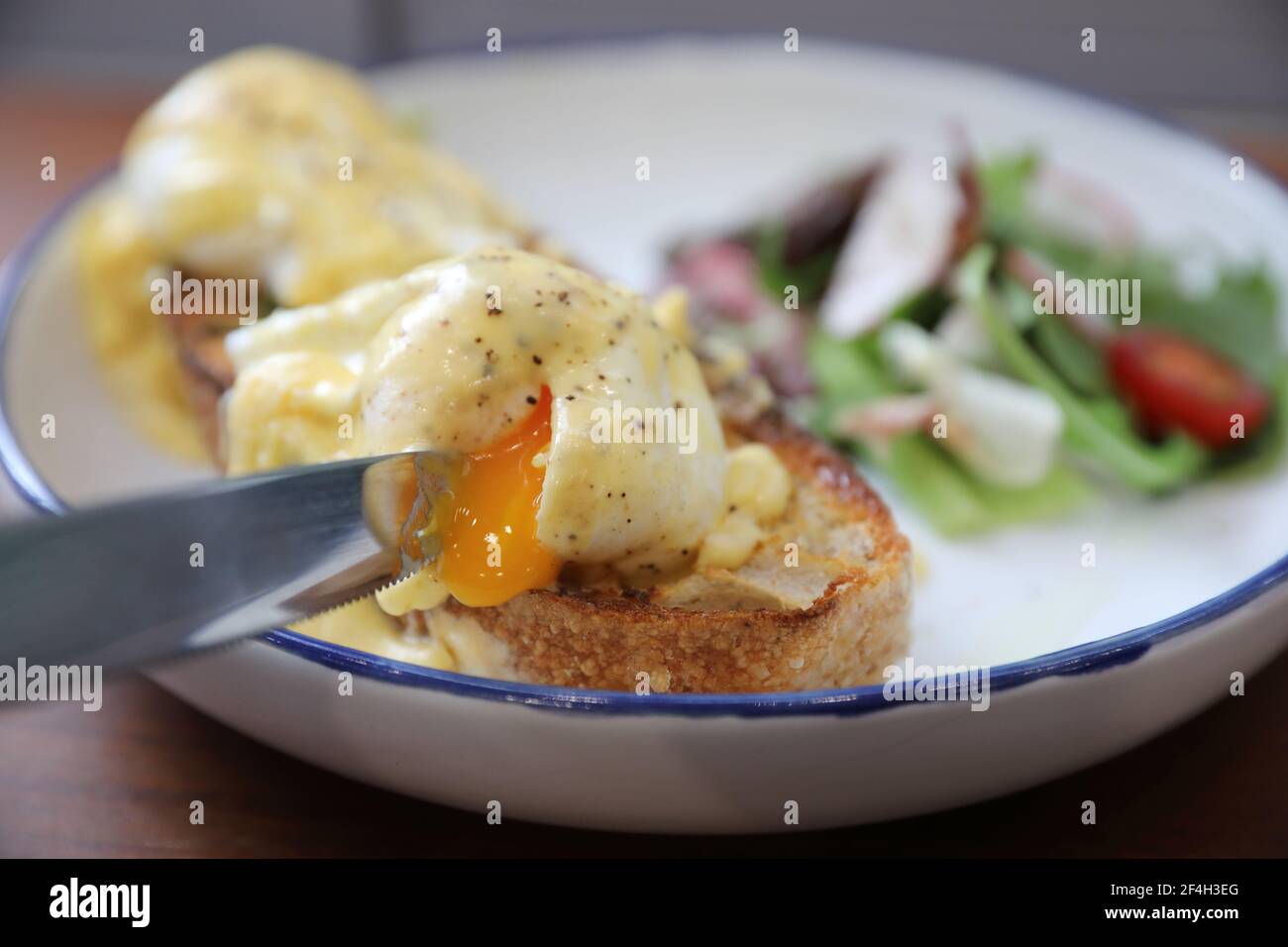 Egg benedict , poached eggs with toast on wood background , English Breakfast Stock Photo Alamy