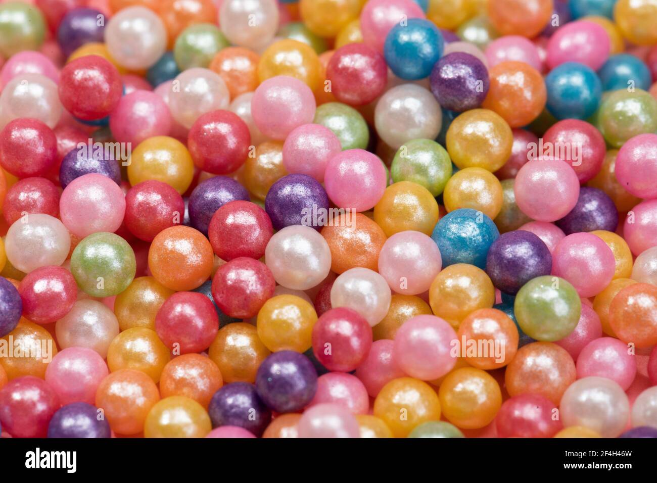 A closeup shot of colorful sweet candy balls Stock Photo - Alamy