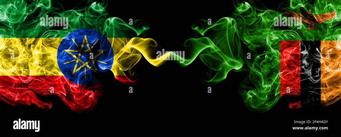 Ethiopia, Ethiopian vs Zambia, Zambian smoky mystic flags placed side by side. Thick colored silky abstract smoke flags. Stock Photo