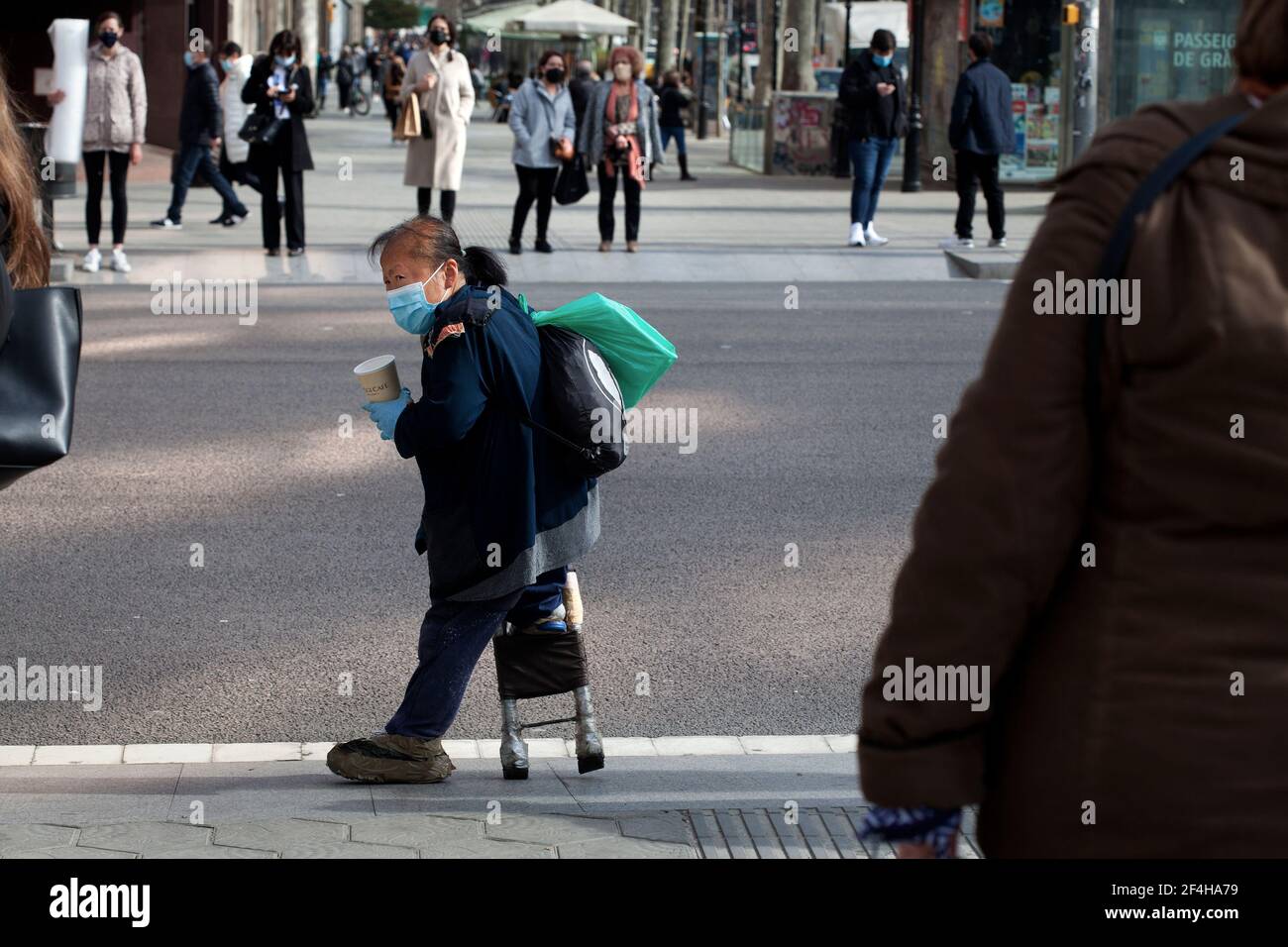 Crippled Asian beggar, Barcelona, Spain. Stock Photo