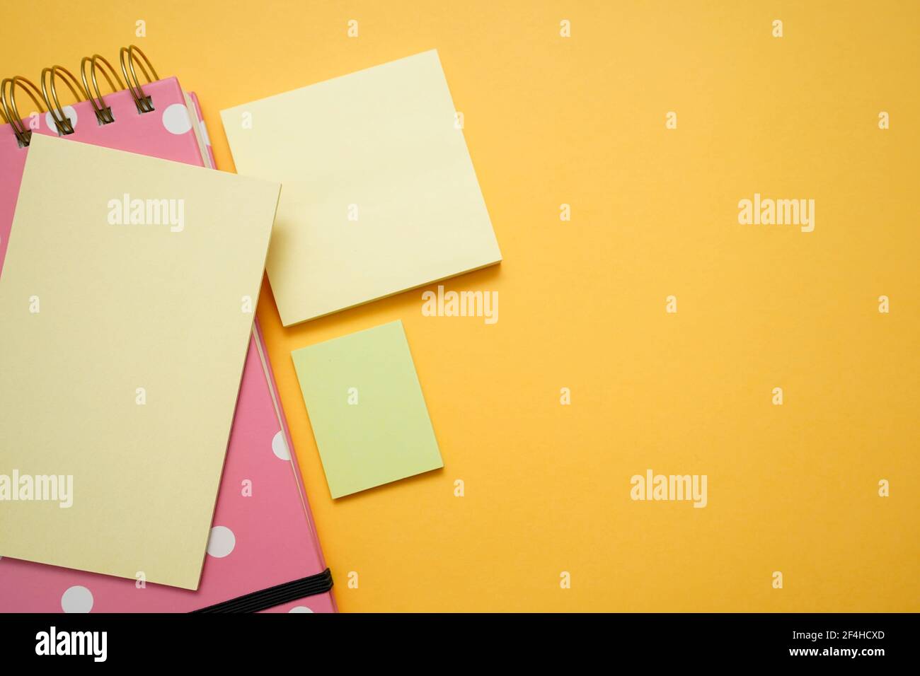 Colorful office supplies on yellow background Stock Photo