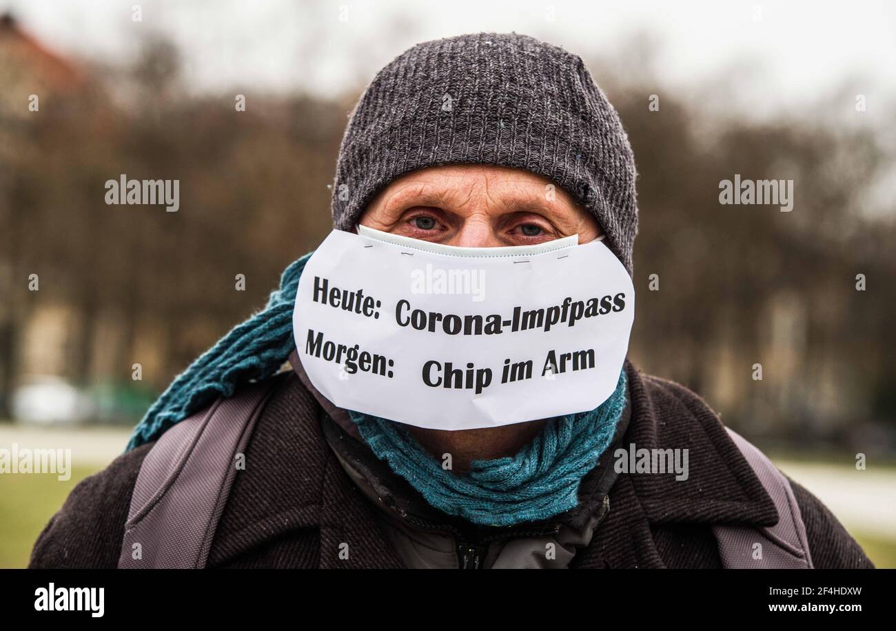 Munich, Bavaria, Germany. 21st Mar, 2021. A demonstrator at the Munich Gemeinsame Zukunft demo protests against the Digital Vaccine Pass and relates it to the conspiracy of chips in the vaccines. The Gemeinsame Zukunft group headed by Susanna Grill of Cocoon Hotels held a demonstration at Munich's Theresienwiese calling for an end to the lockdown politics of Germany and reasonable anti-Corona measures. Despite the requests for 1,000 'reasonable people'' to be there, the group had less than 100, with many known from the Querdenken/Corona Rebel and neonazi/NPD members, far-right/conspirac Stock Photo