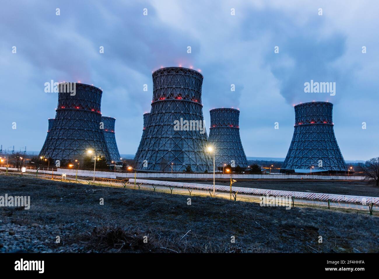 Cooling tower of nuclear power plant at night Stock Photo - Alamy
