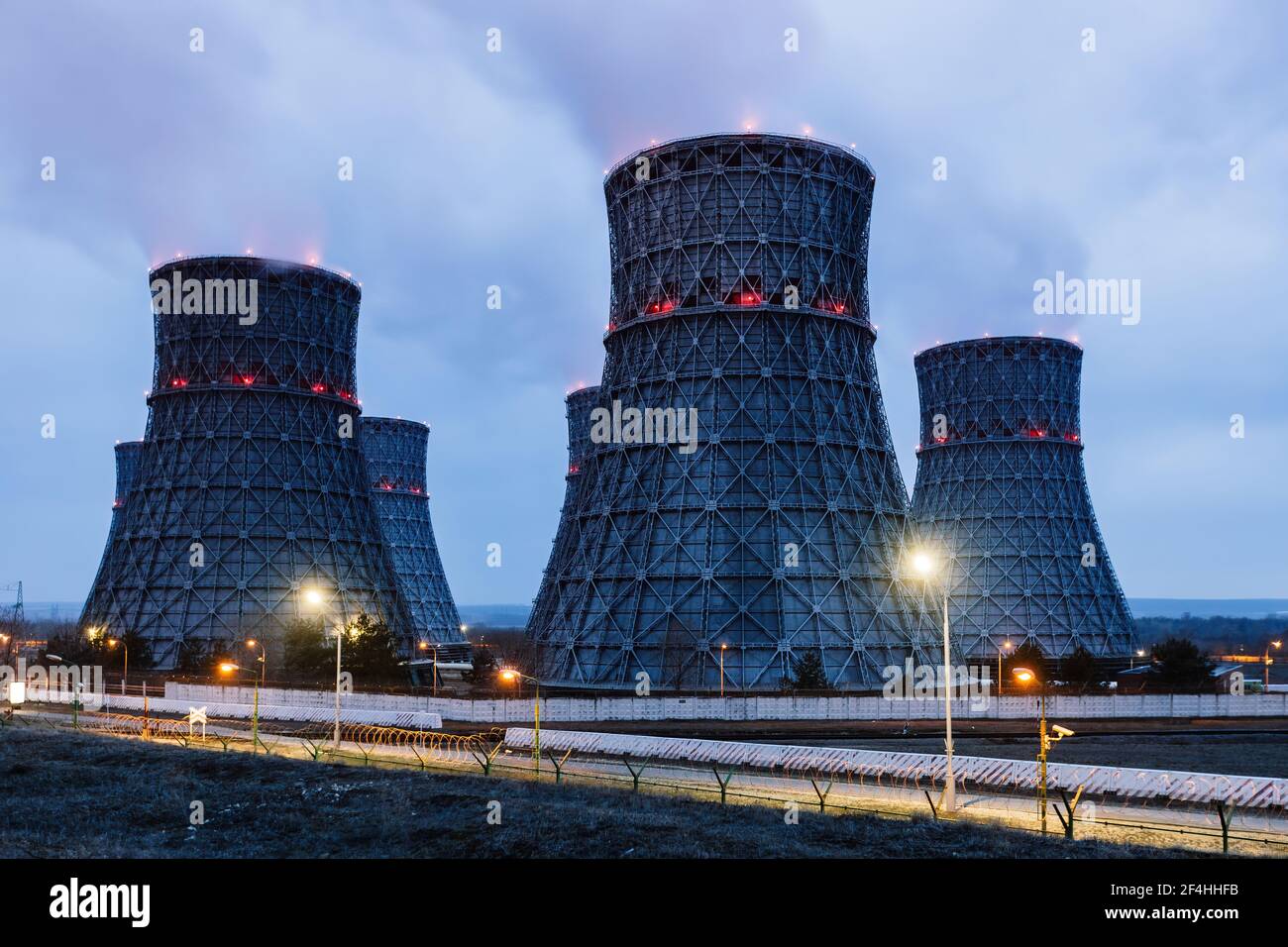 Cooling tower of nuclear power plant at night Stock Photo - Alamy