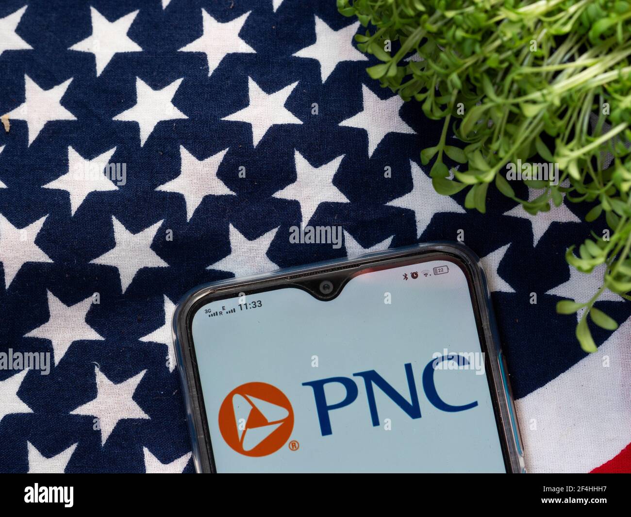 In this photo illustration a PNC Financial Services logo seen displayed ...
