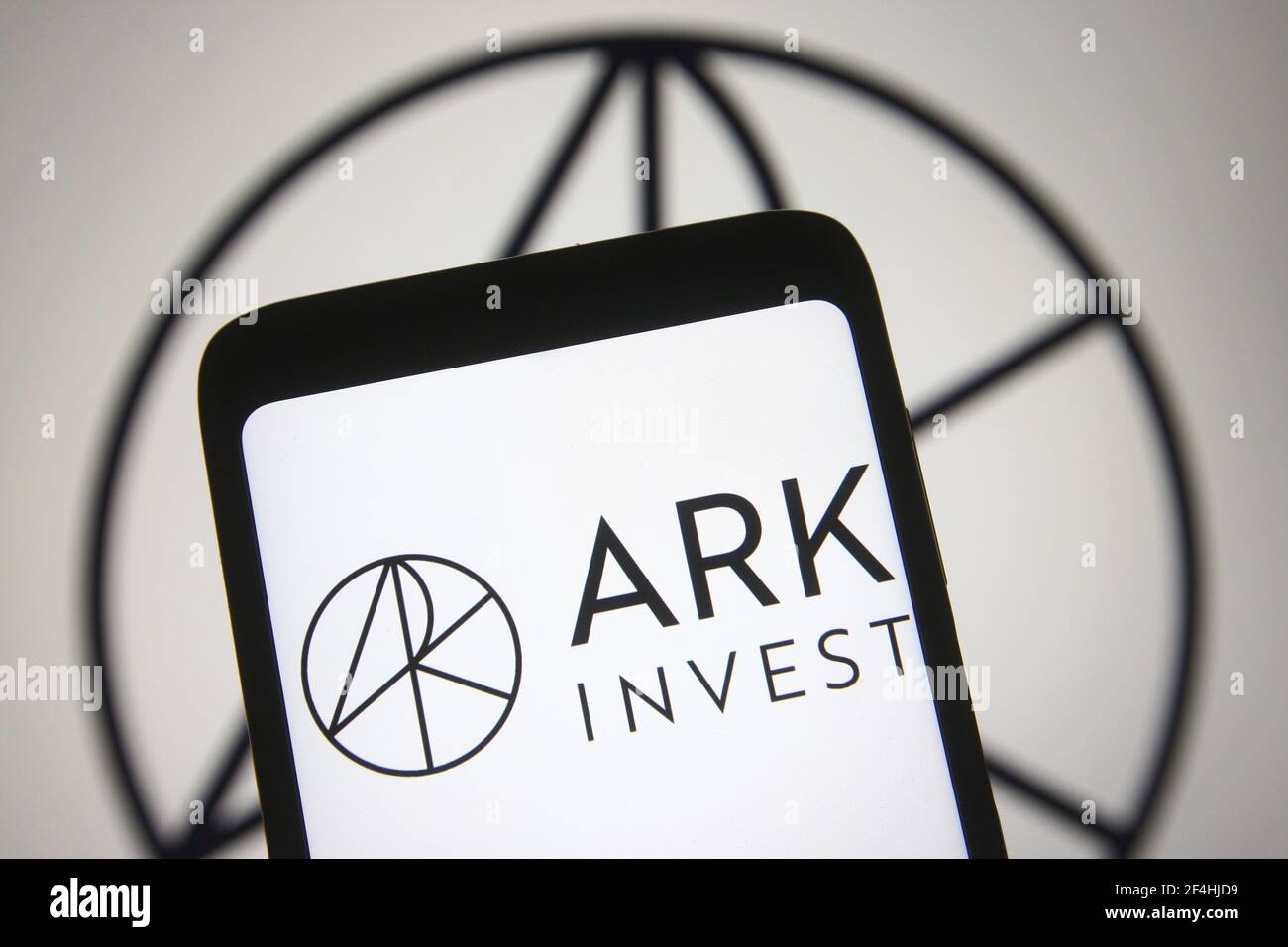 Ukraine. 21st Mar, 2021. In this photo illustration an ARK investment logo of ARK Investment Management LLC, an asset management company, is seen on a smartphone and a pc screen. (Photo by Pavlo Gonchar/SOPA Images/Sipa USA) Credit: Sipa USA/Alamy Live News Stock Photo