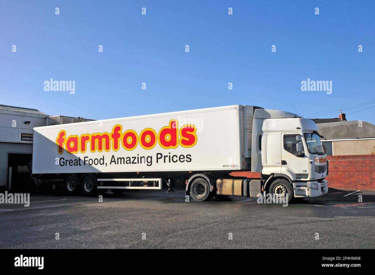 Farm Foods articulated supply lorry delivering goods to a store on Devonshire Road Blackpool Lancashire England United Kingdom Stock Photo