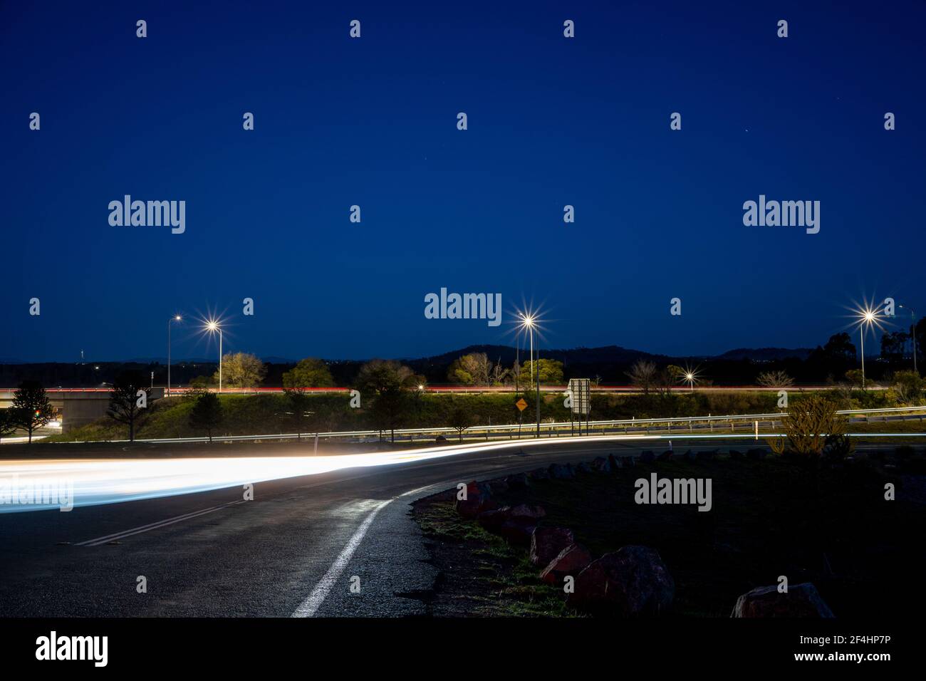 Light trail and sparkling light post at the Tuggeranong highway, National Arboretum Canberra Stock Photo