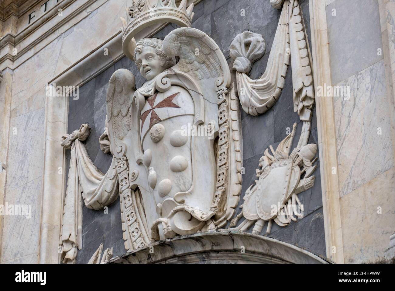 A low angle shot of a marble sculpture of an angel with a crown Stock Photo