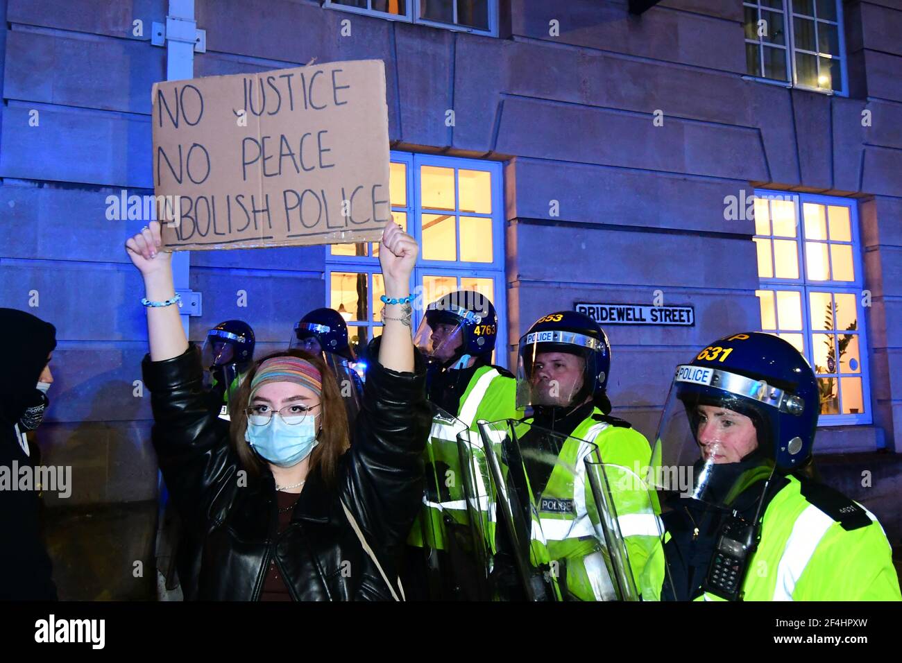 Bristol, UK. 21st Mar, 2021. UK Bristol .Police with riot shields and dogs out on the Streets of Bristol after a night of damaged police vans, police cars set alight and all surounding roads blocked with police cars, vans dog handlers and police on horseback in a cloud of thick smoke from thrown fireworks. Picture Credit: Robert Timoney/Alamy Live News Stock Photo