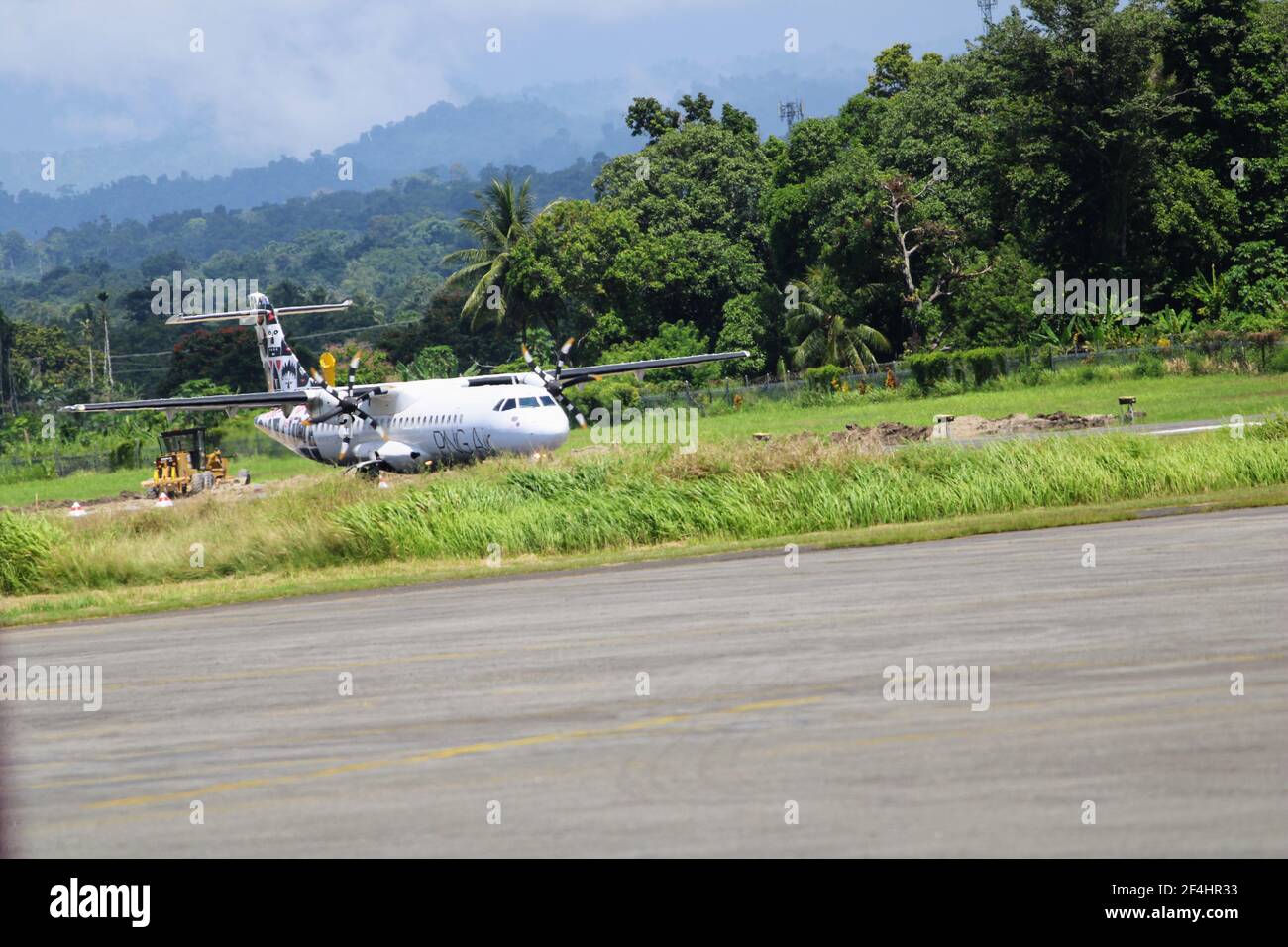 PNG Air's ATR 72 on the runway at Madang airport, Papua New Guinea. Stock Photo