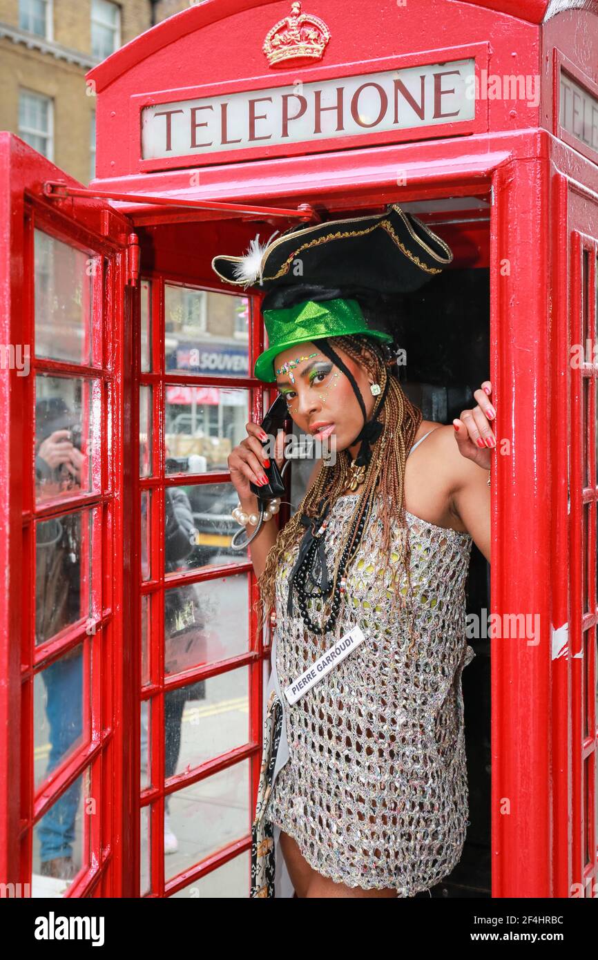 Posing by red telephone box hi-res stock photography and images - Alamy