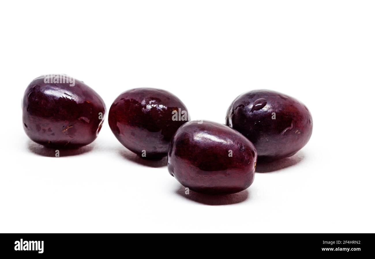 many red grapes on white background Stock Photo