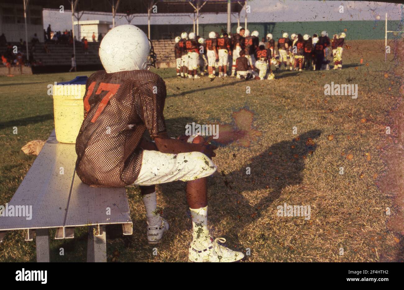 Junior High 'Homecoming' game against Dobie Middle School vs. BUrnet Middle School.  Player sitting alone on the bench. Stock Photo