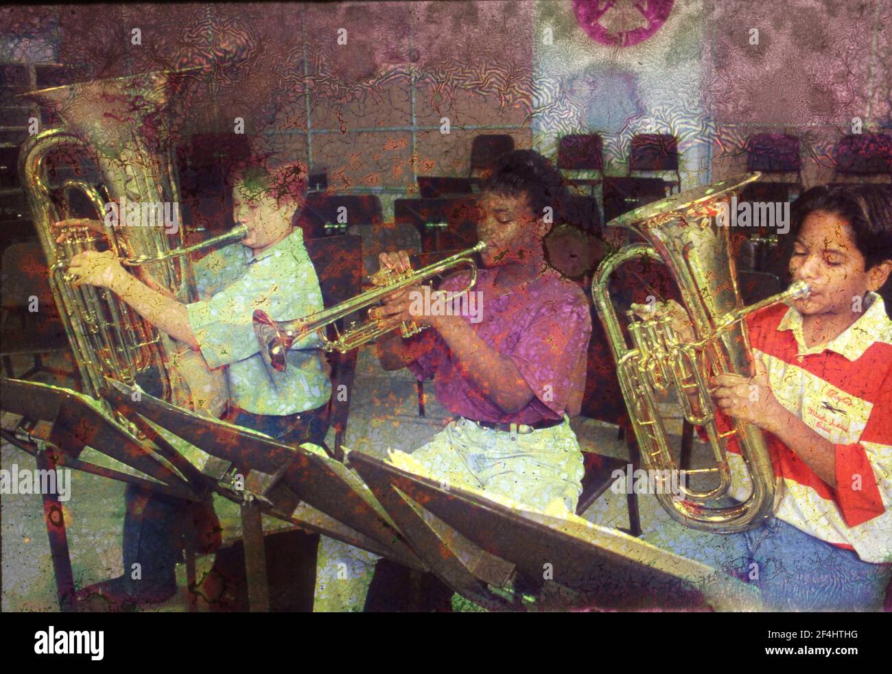 Junior High Students playing in school orchestra, Austin Texas. MODEL RELEASE XEP0040-0042  1993 Stock Photo