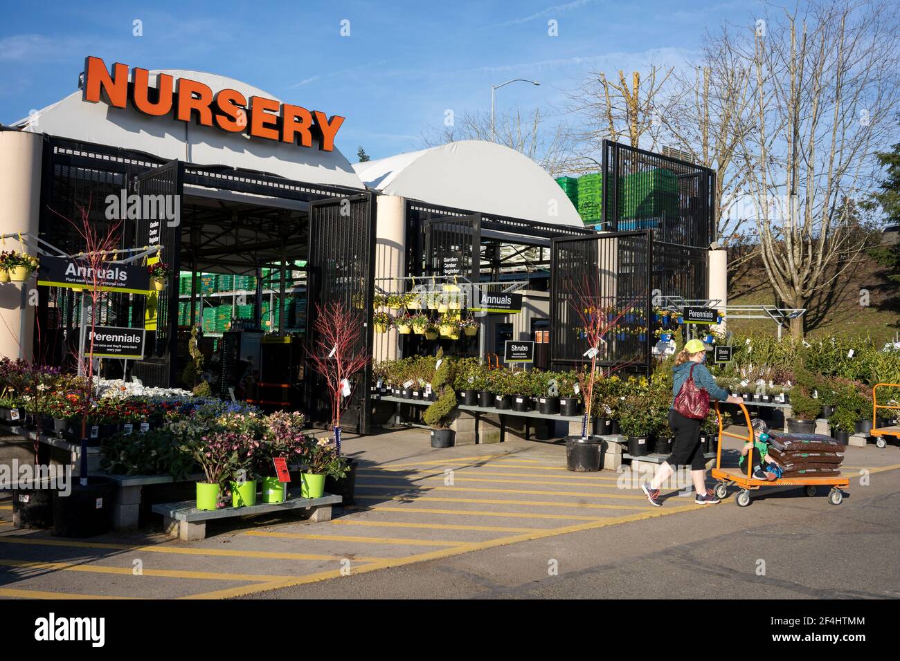 A shopper leaving the nursery department in the Home Depot in Tigard, Ore., on March 13, 2021, as springtime approaches amid the pandemic. Stock Photo