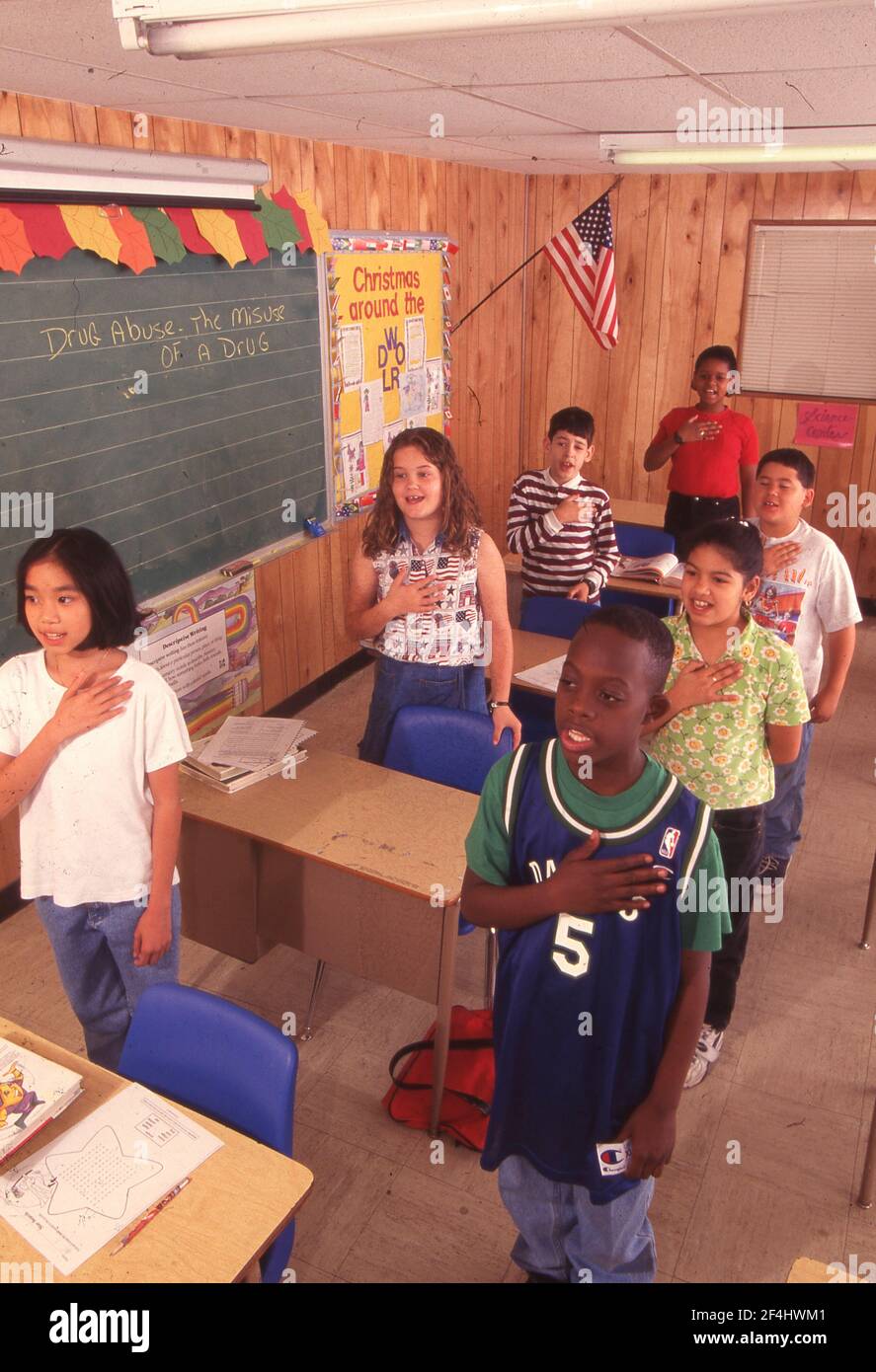 CITIZENSHIP:  4th grade class says the U.S. Pledge of Allegiance in class, Walnut Creek Elementary School.  MODEL RELEASES EU-38-45   1997 Stock Photo