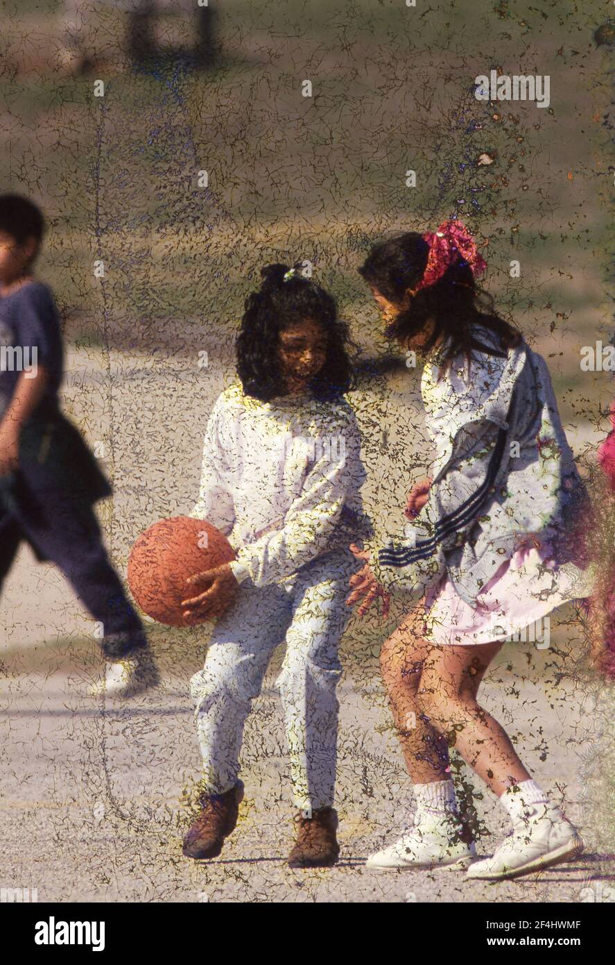 Playground pickup basketball game at Linder Elementary School, Austin, Texas  1994 Stock Photo