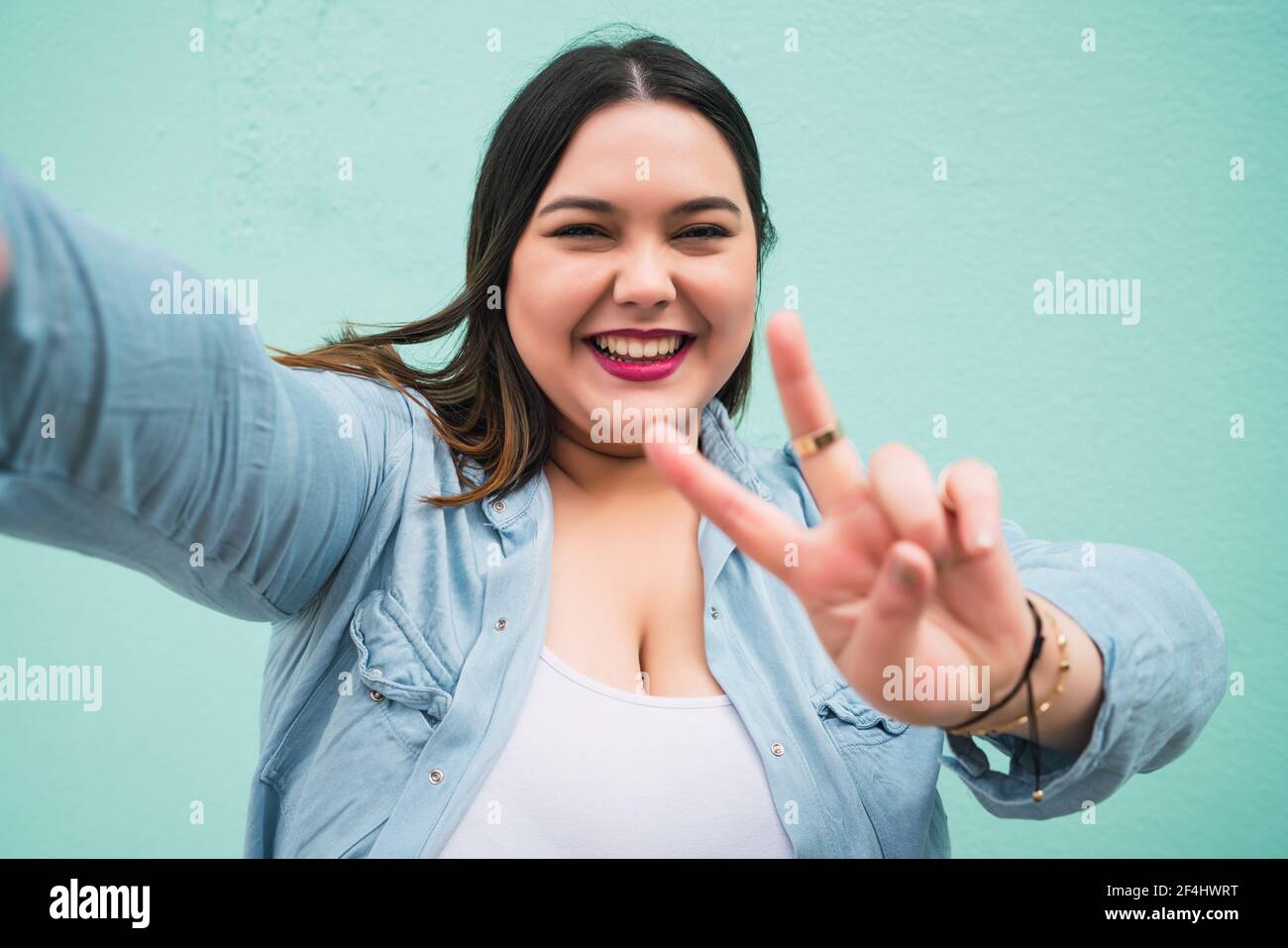 Plus size woman taking a selfie Stock Photo - Alamy