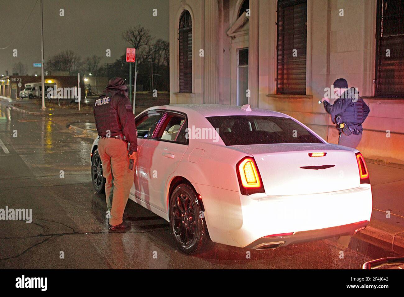 Detroit Police Special Ops officers approach a car to speak with its driver, Detroit, Michigan, USA Stock Photo