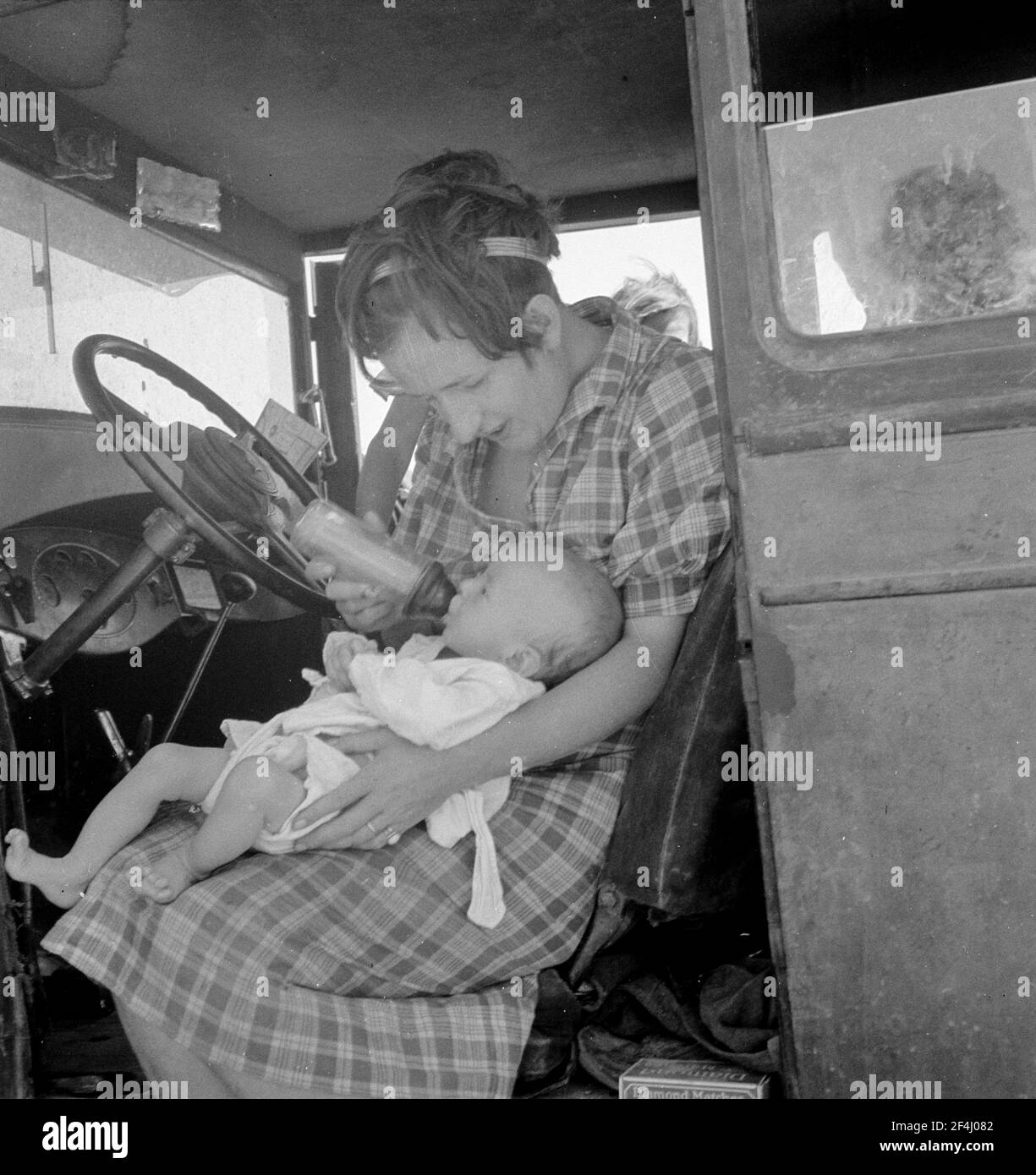 Wife and sick child of tubercular itinerant, stranded in New Mexico. August 1936. Photograph by Dorothea Lange. Stock Photo