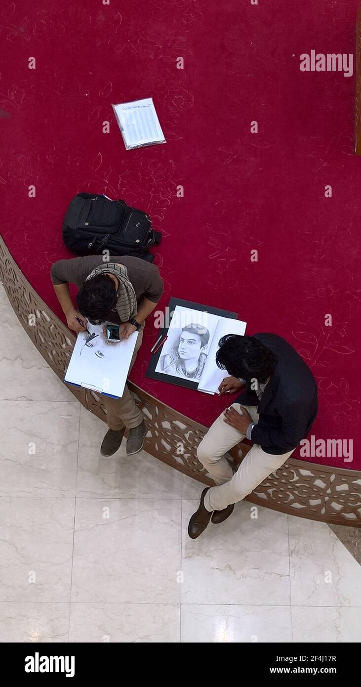 basra, iraq- march 16, 2017:  top photo of art sketcher in times squqre of basra city Stock Photo