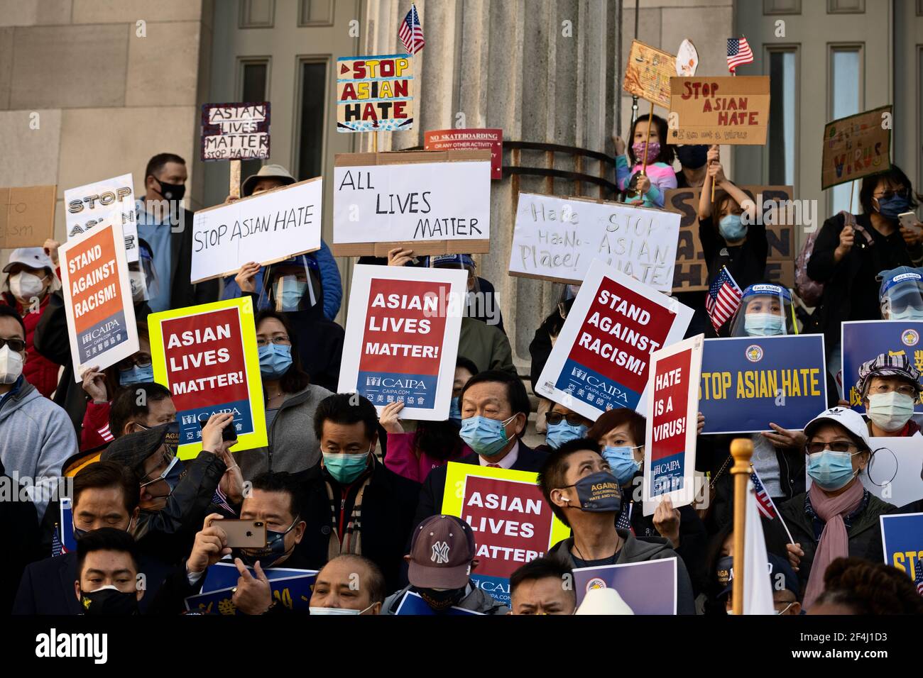Brooklyn, New York, USA. 21 March 2021 People on steps of Brooklyn Borough Hall rally against violence and discrimination after recent attacks against Asian-Americans in New York City and across the U.S. during the COVID-19  pandemic. Credit: Joseph Reid/Alamy Live News Stock Photo