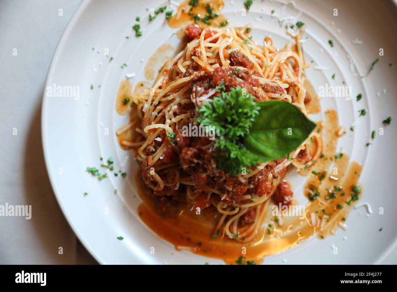 spaghetti Bolognese with minced beef and tomato sauce garnished with