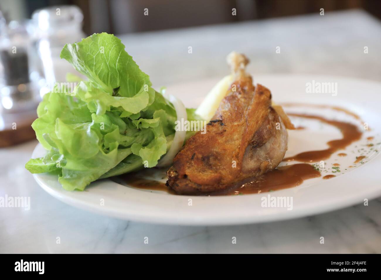 confit de canard , Duck confit with vegetable Stock Photo - Alamy