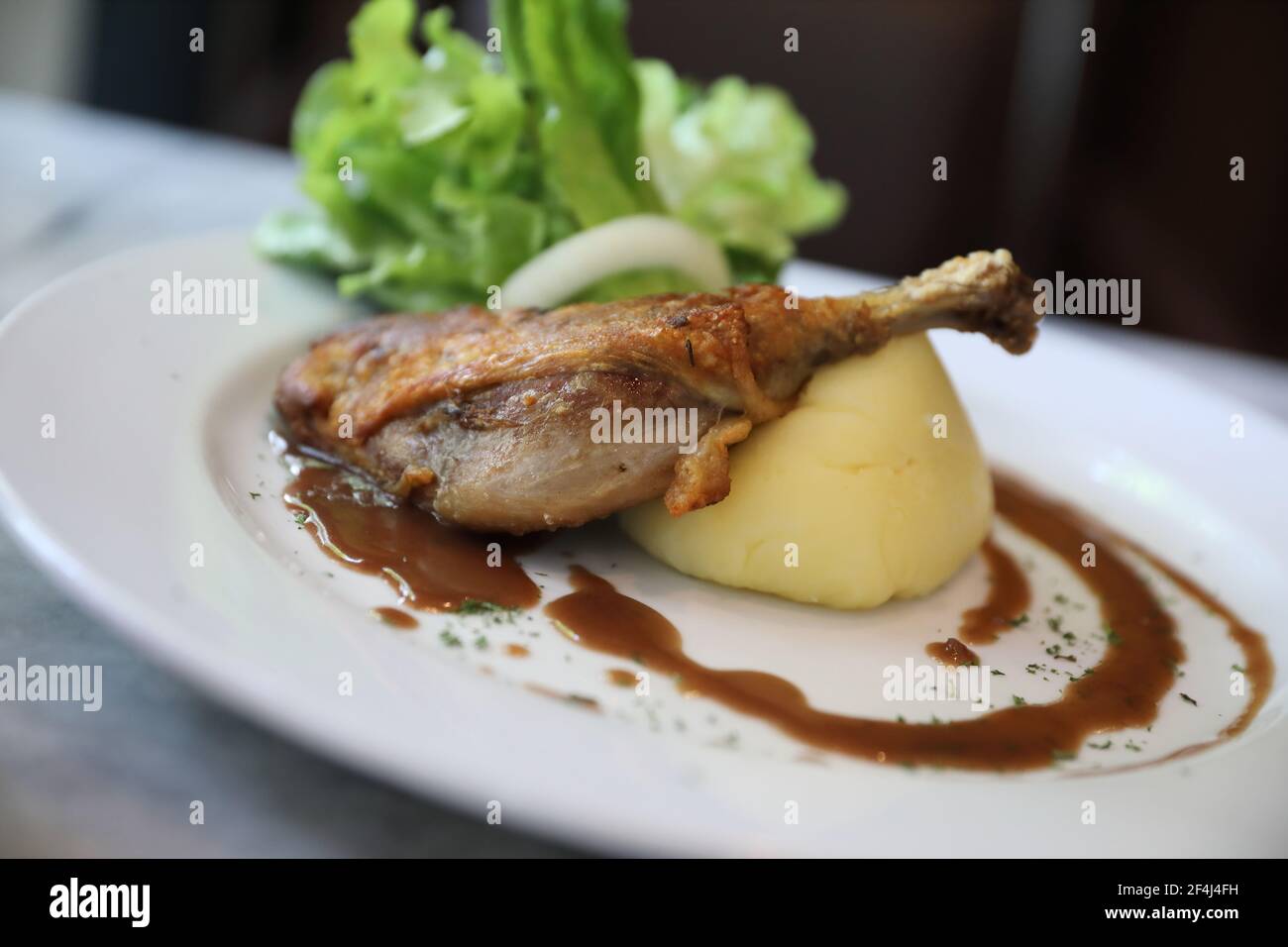confit de canard , Duck confit with vegetable Stock Photo - Alamy