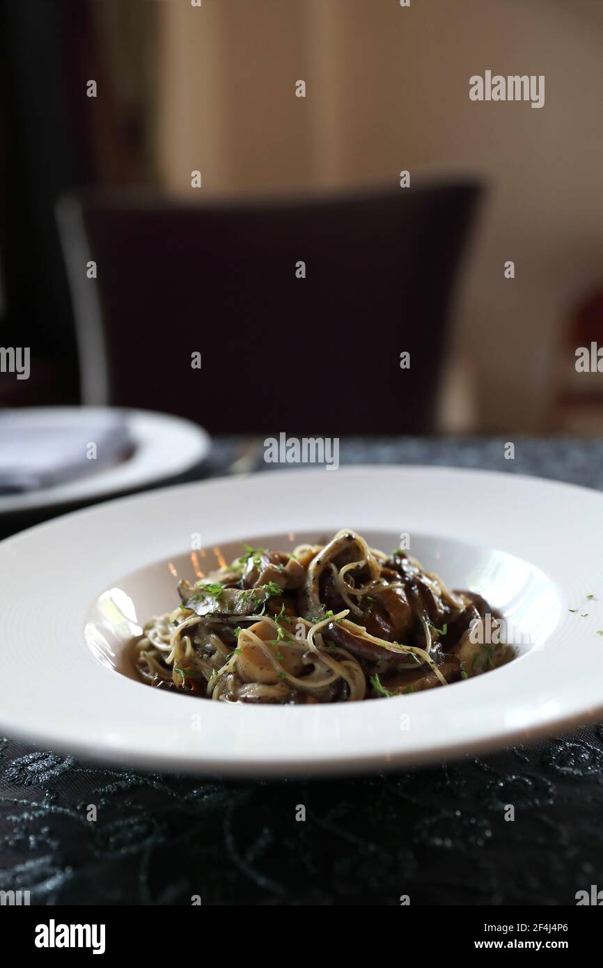 Spaghetti truffle cream sauce with mushroom Stock Photo Alamy