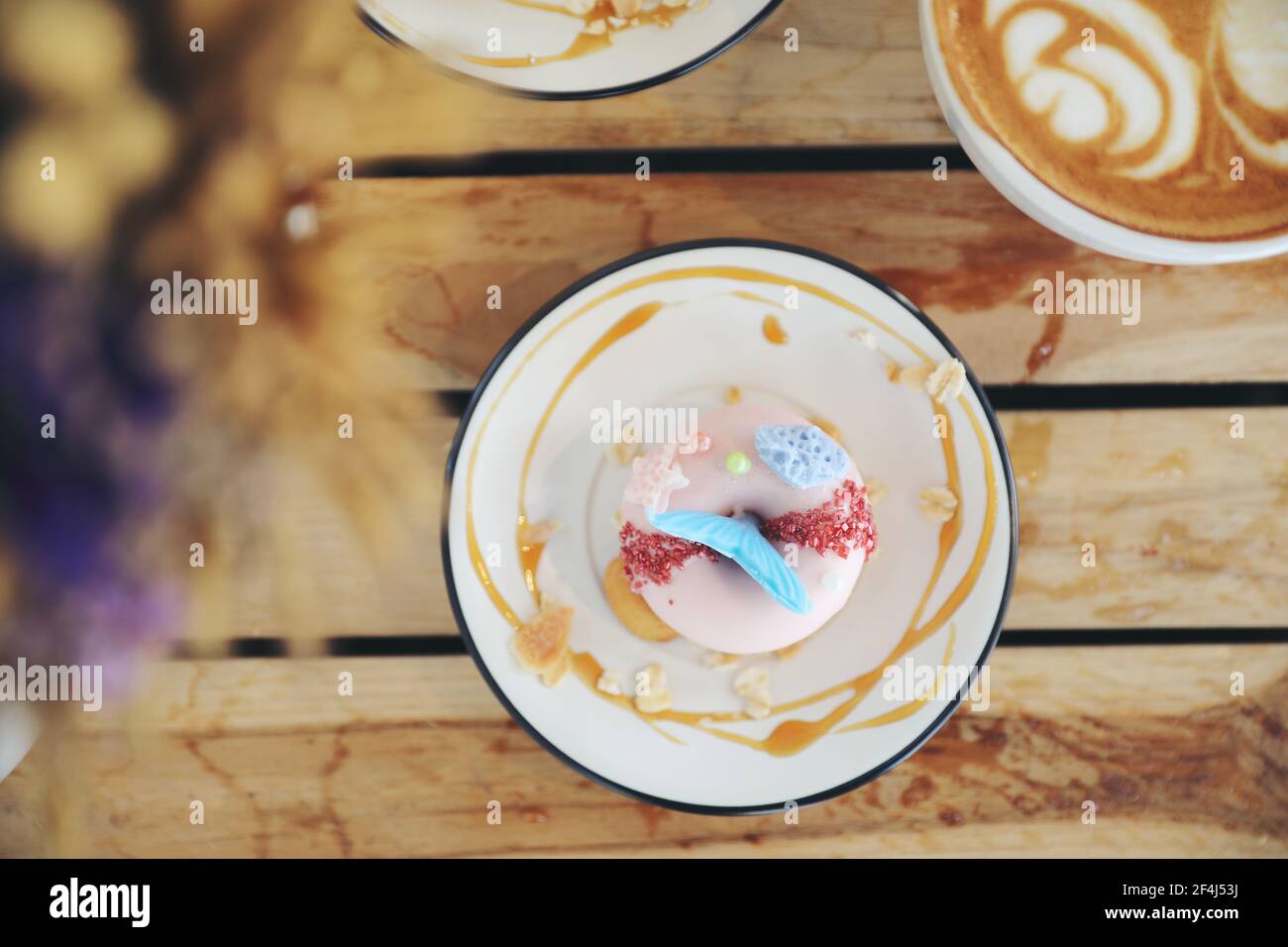 Fancy donut with cute mermaid on top Stock Photo