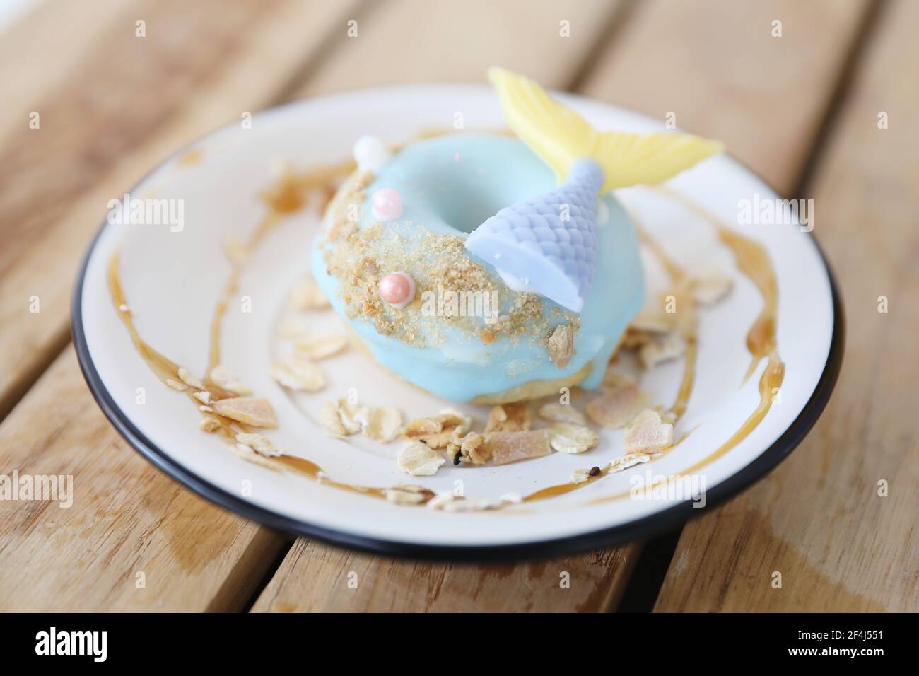 Fancy donut with cute mermaid on top Stock Photo