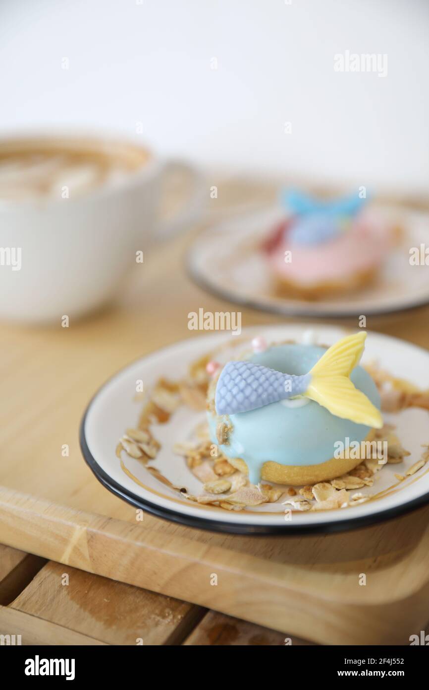 Fancy donut with cute mermaid on top Stock Photo