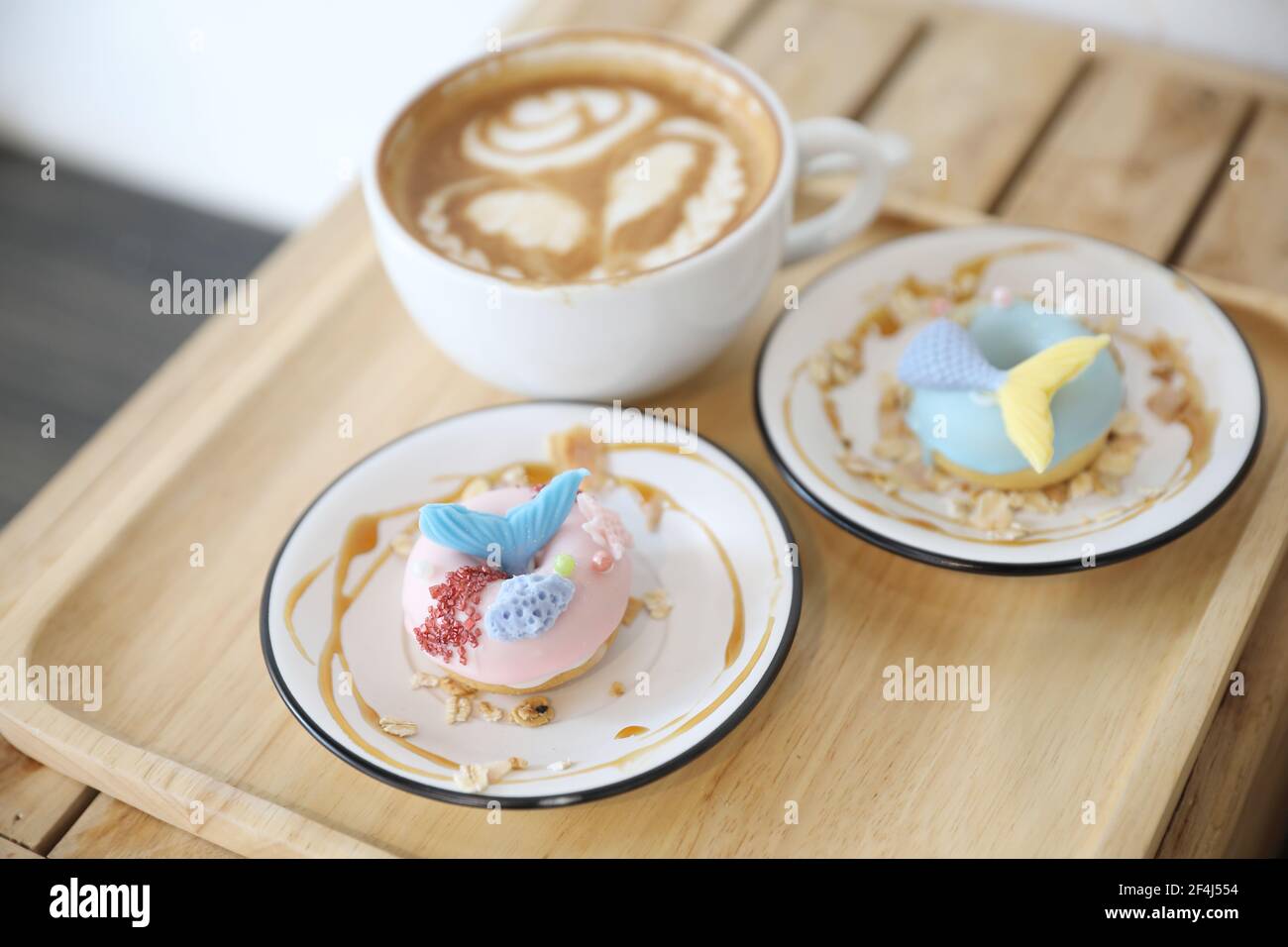 Fancy donut with cute mermaid on top Stock Photo