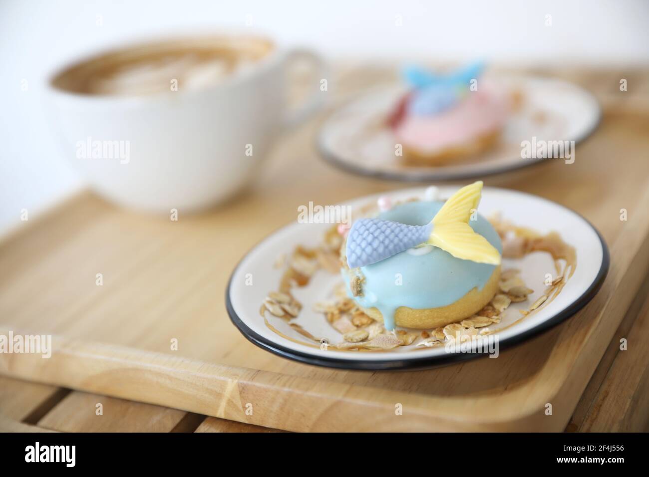 Fancy donut with cute mermaid on top Stock Photo