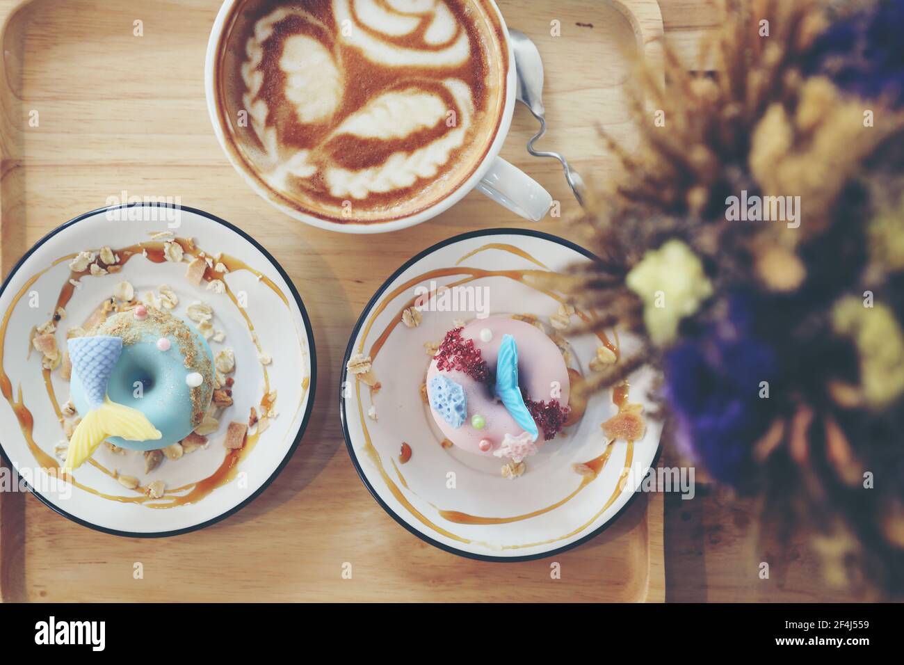 Fancy donut with cute mermaid on top Stock Photo