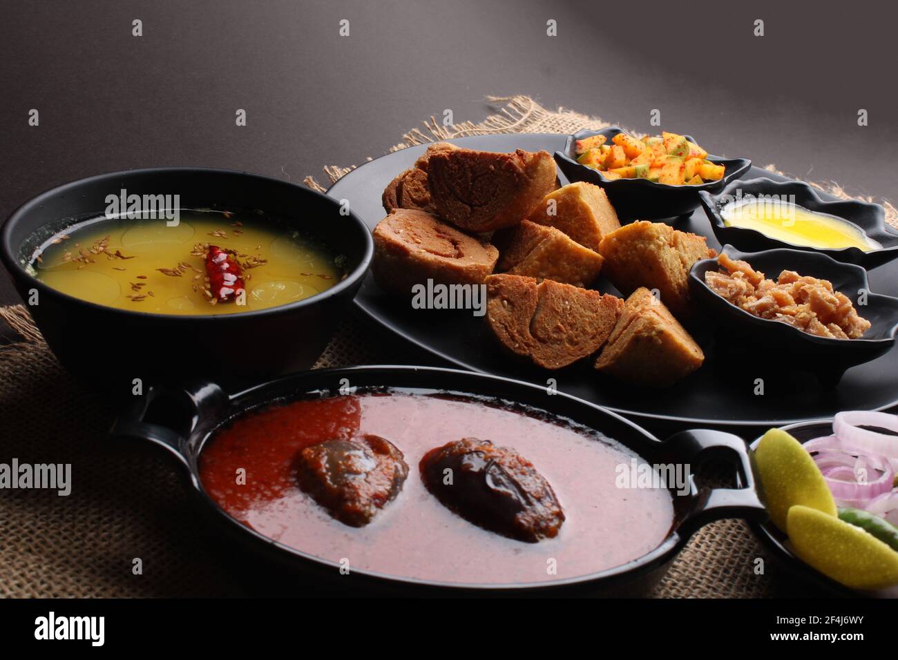 bafle or bati is popular main course dish in India served with dal daal