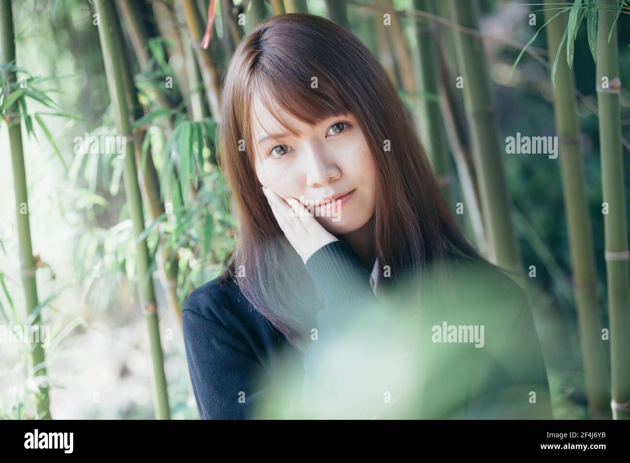 Portrait of asian japanese school girl costume looking at park outdoor