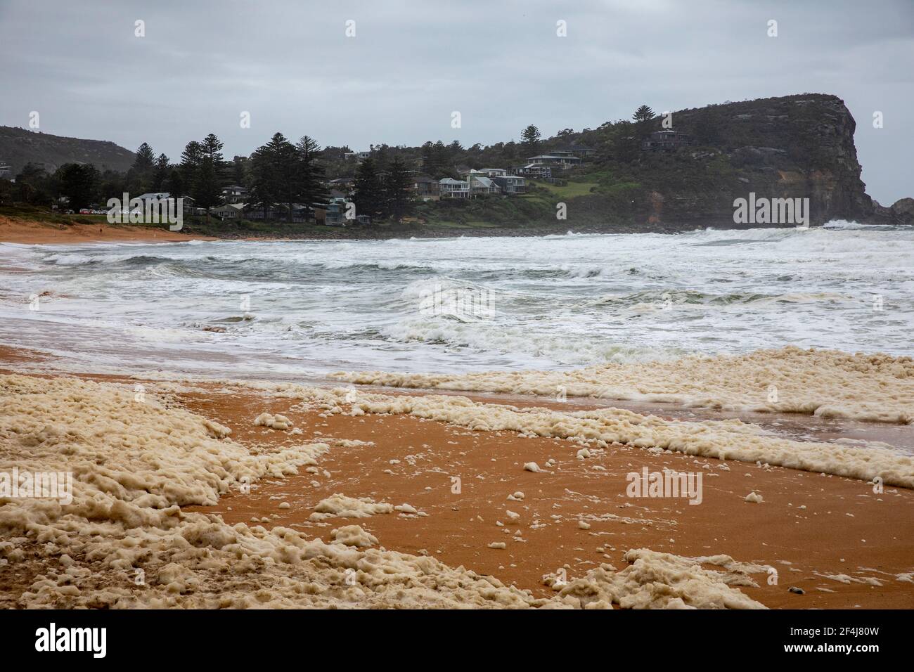 Sydney heavy storms and wild surf with sea foam on the beach during the New South Wales floods of march 2021,Australia Stock Photo
