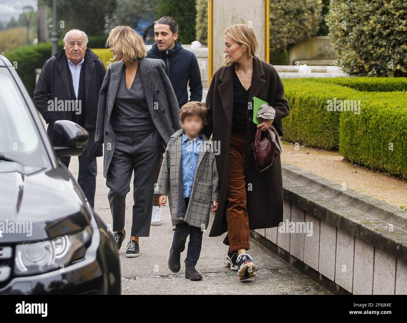 Coruna-Spain. Amancio Ortega (founder of Zara) with his family walking  through a park as a family on November 11, 2018 Stock Photo - Alamy