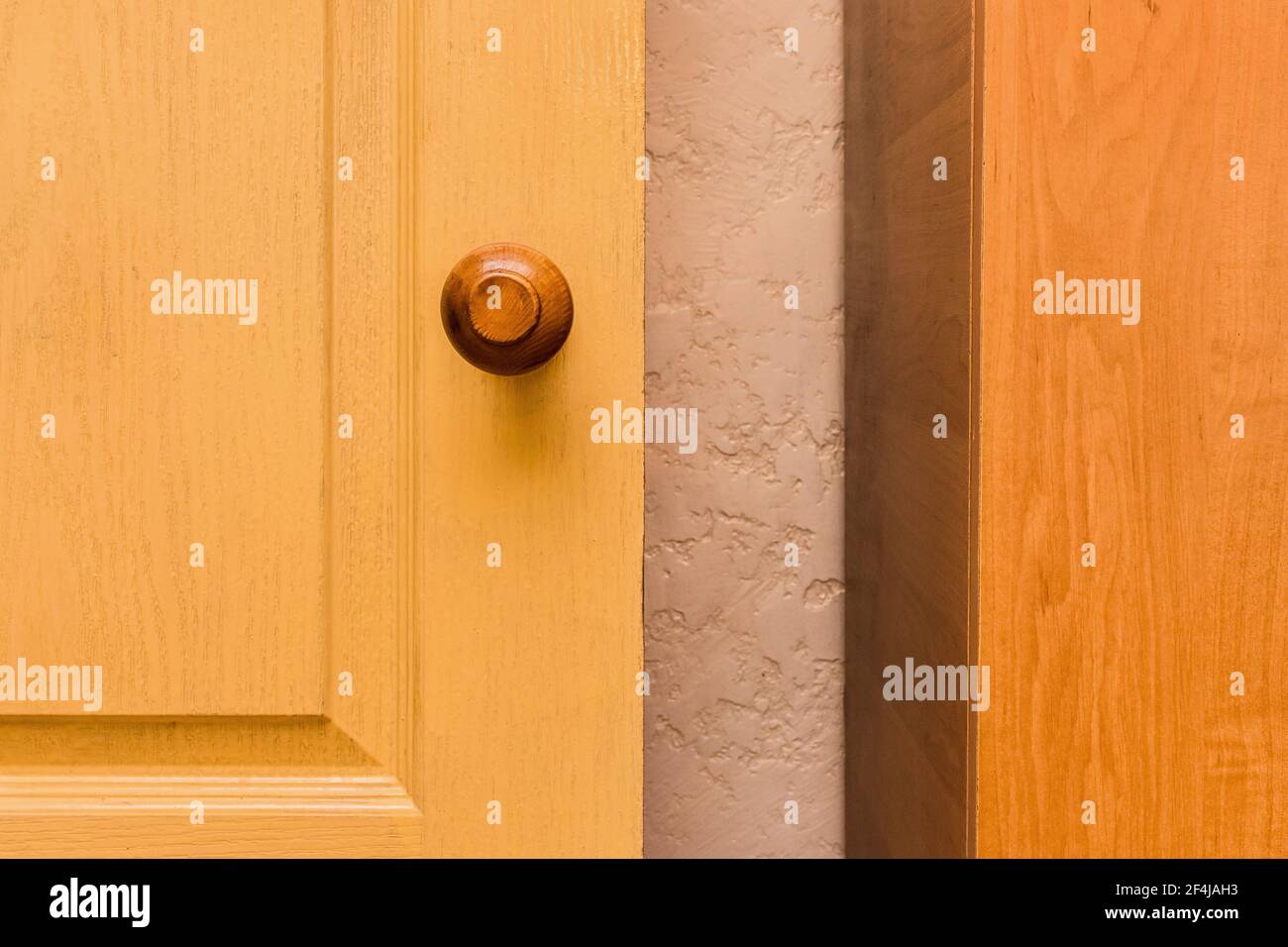 Yellow wooden door, element of interior room background. Stock Photo