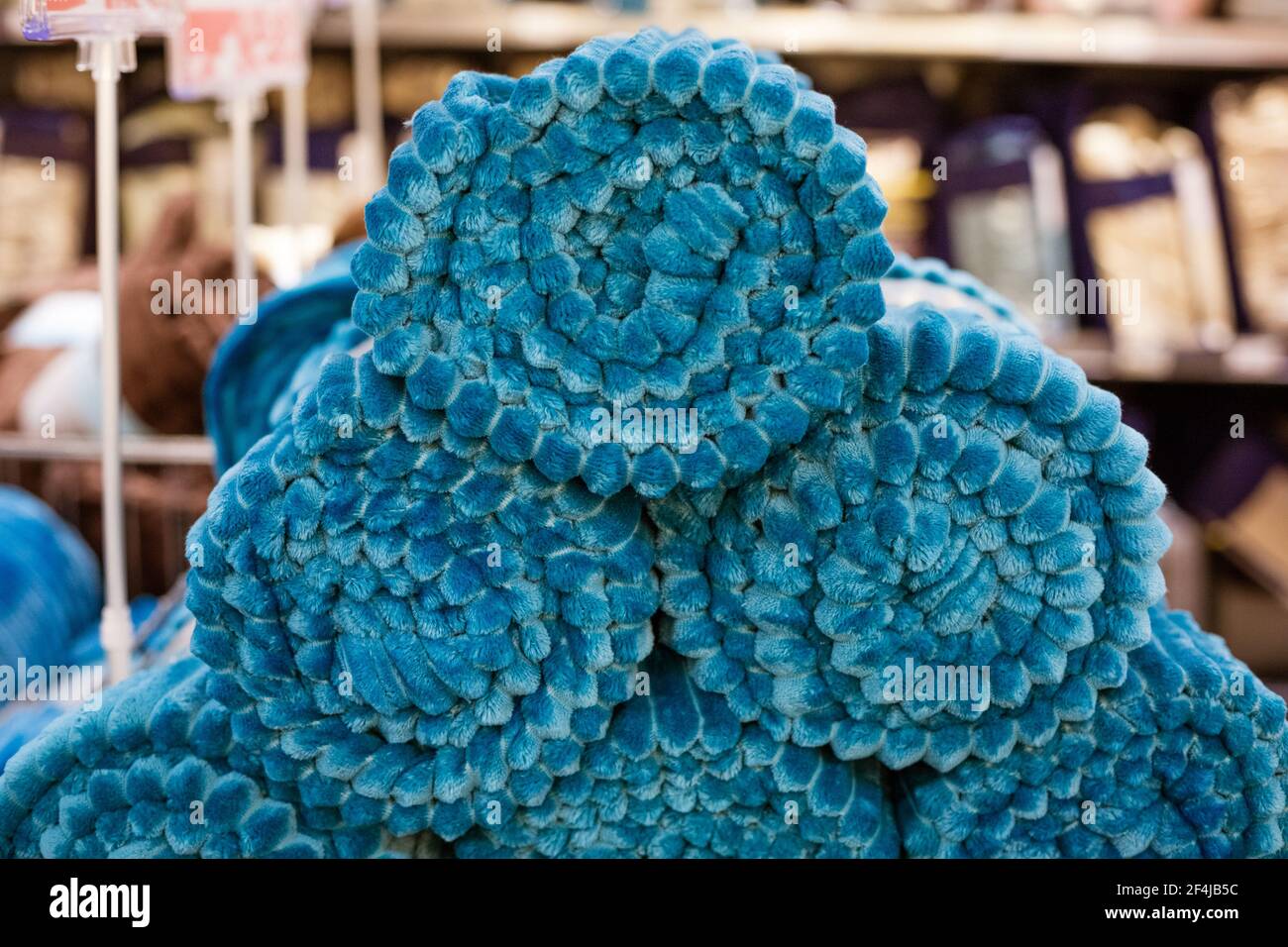 folded blankets in a store in blue Stock Photo Alamy