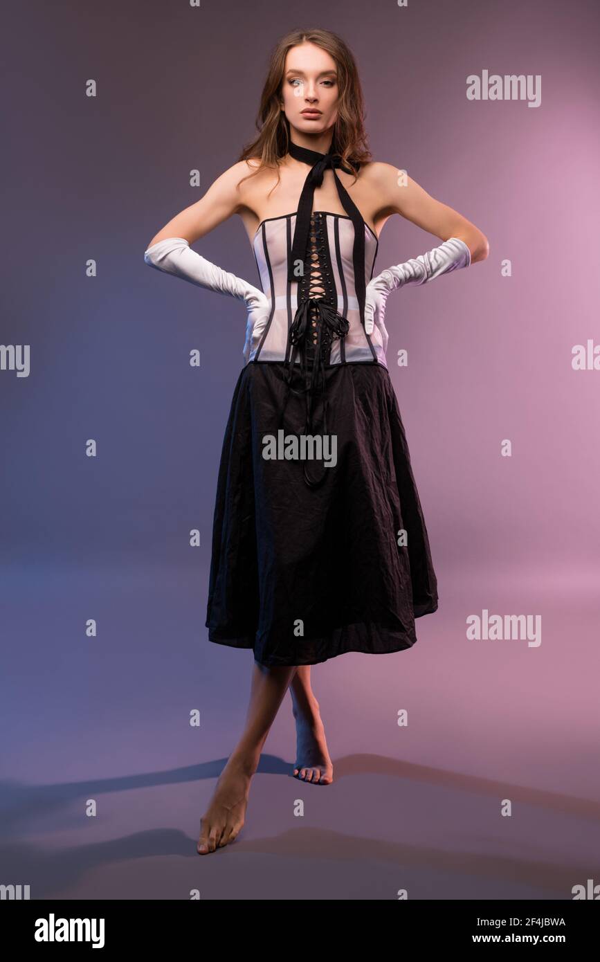 Female model in elegant clothes with corset Stock Photo