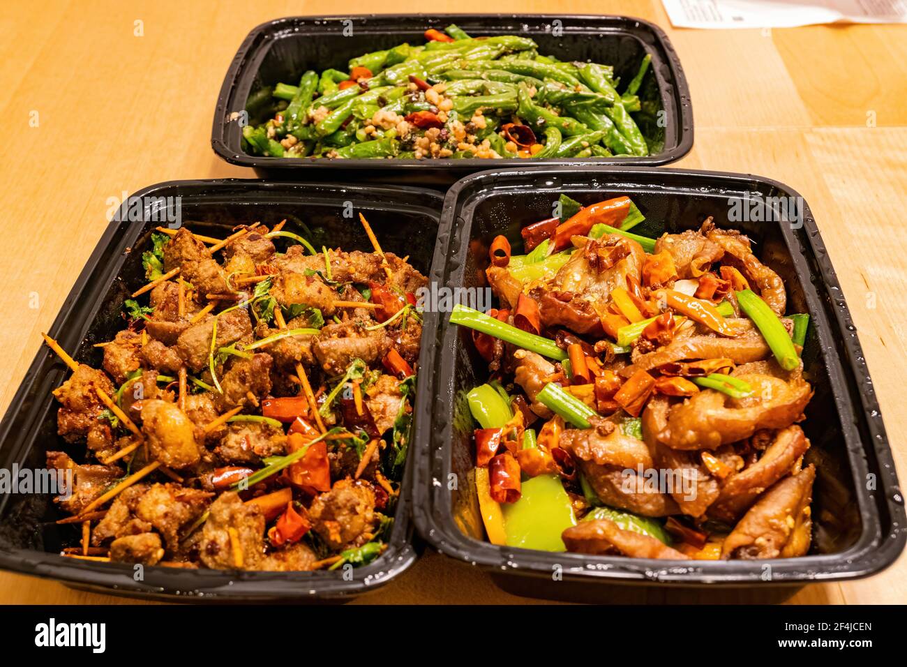 Close up shot of deep fried pork intestines, green bean and cumin lamb