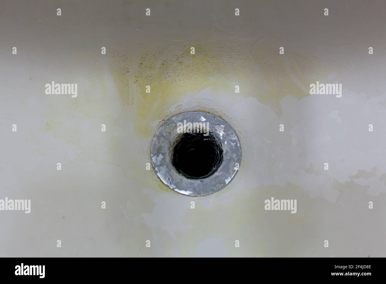 Close up of a sinkhole or bathtub hole in a dirty bathroom. There are ...